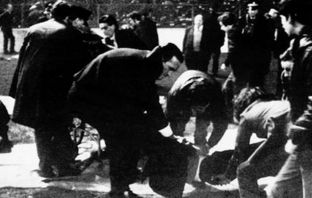 Celtic manager Jock Stein helping the injured at the Ibrox disaster in 1971