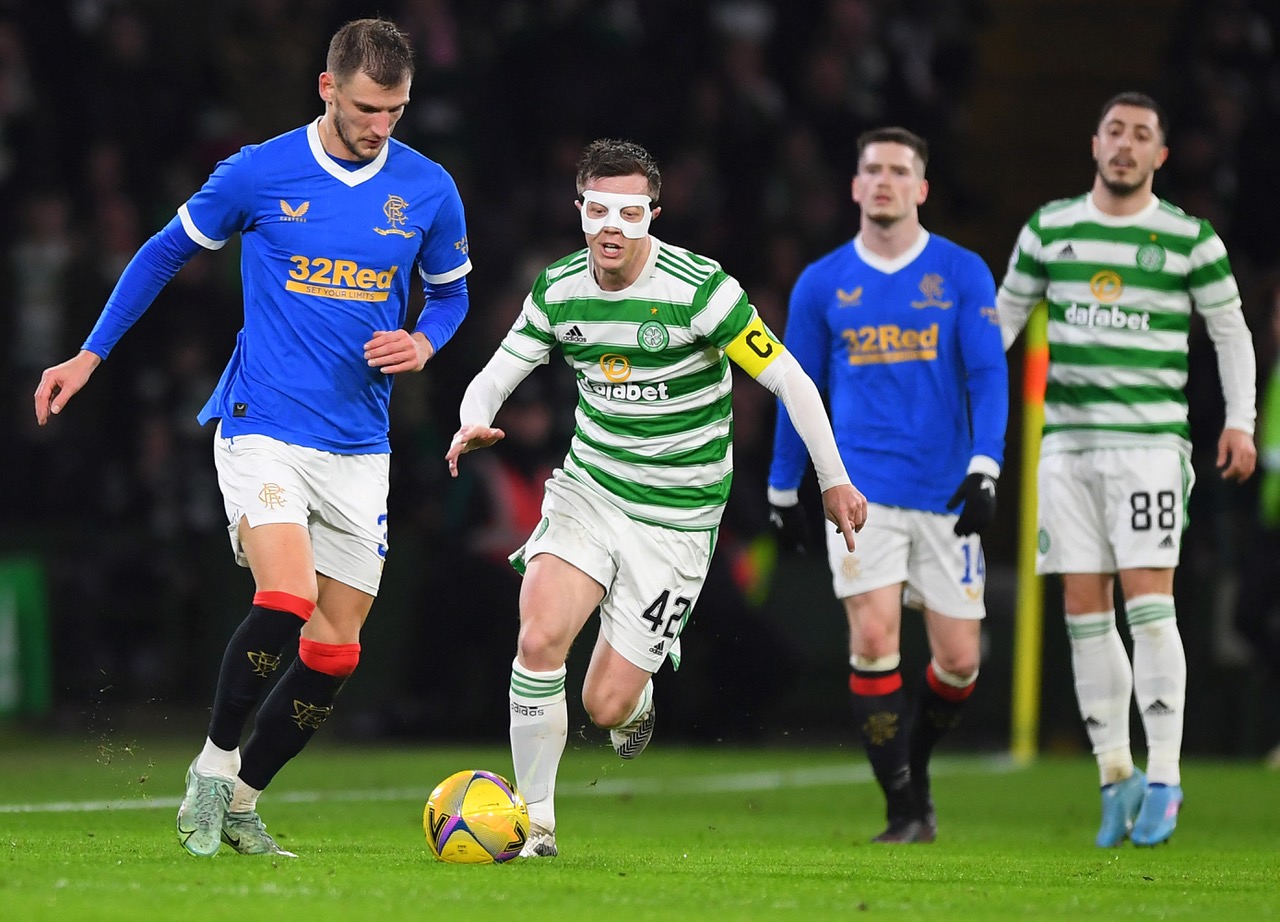 Callum McGregor playing with a mask