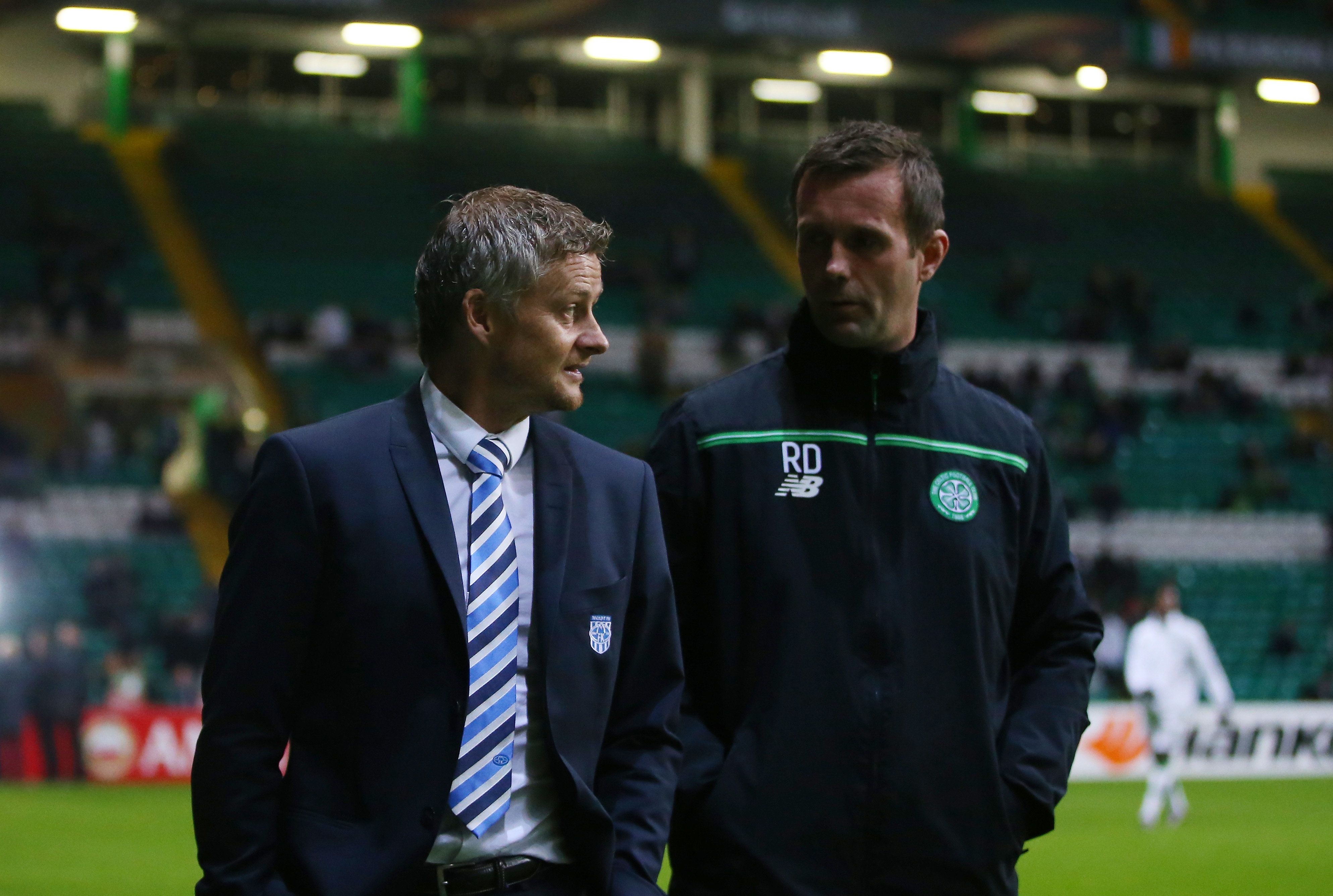Ronny Deila the manager of Celtic chats with Ole Gunnar Solskjaer