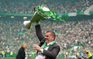 Ange Postecoglou celebrates with the league trophy