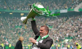 Ange Postecoglou celebrates with the league trophy