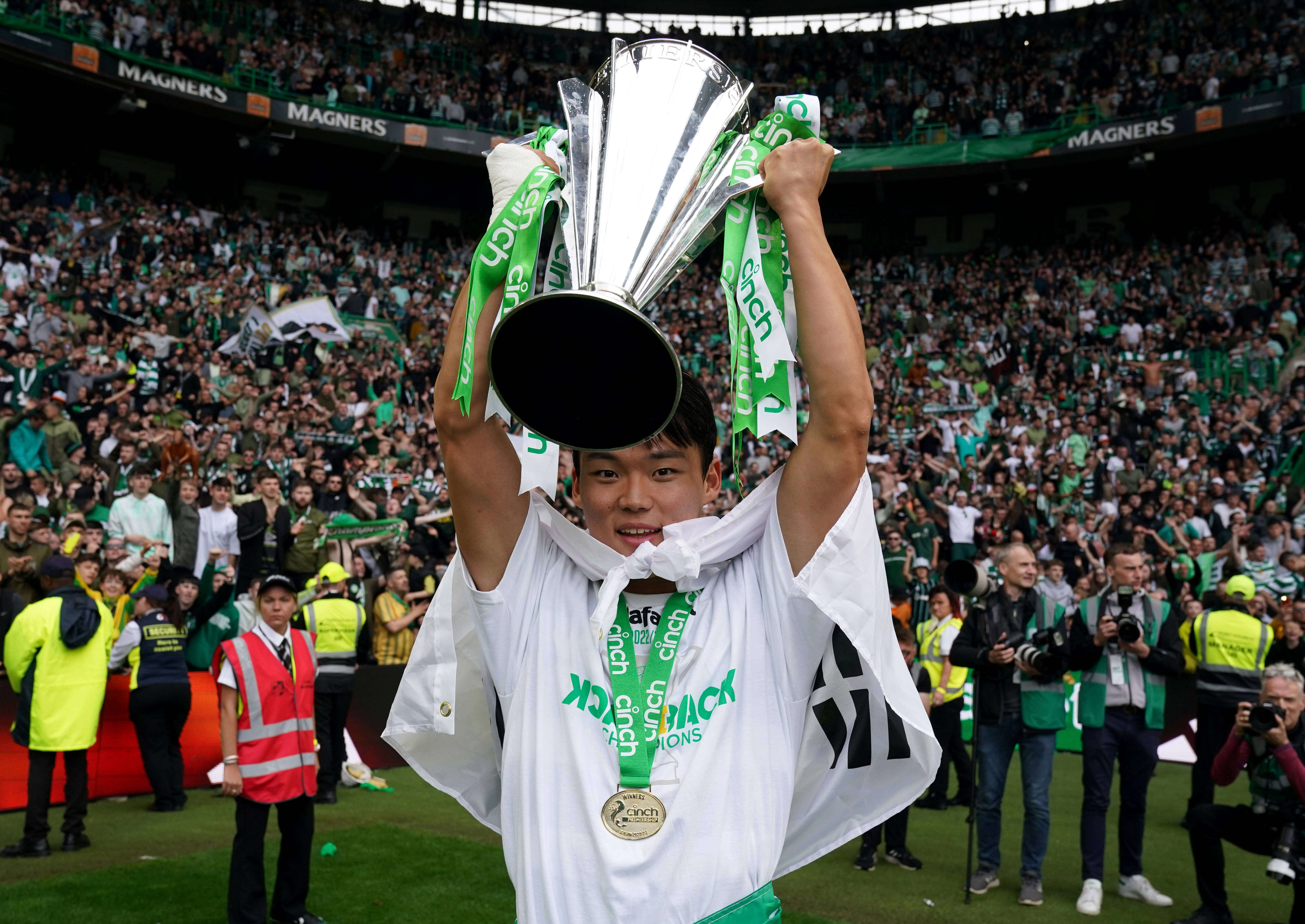 Celtic's Oh Hyeon-gyu celebrates with the trophy