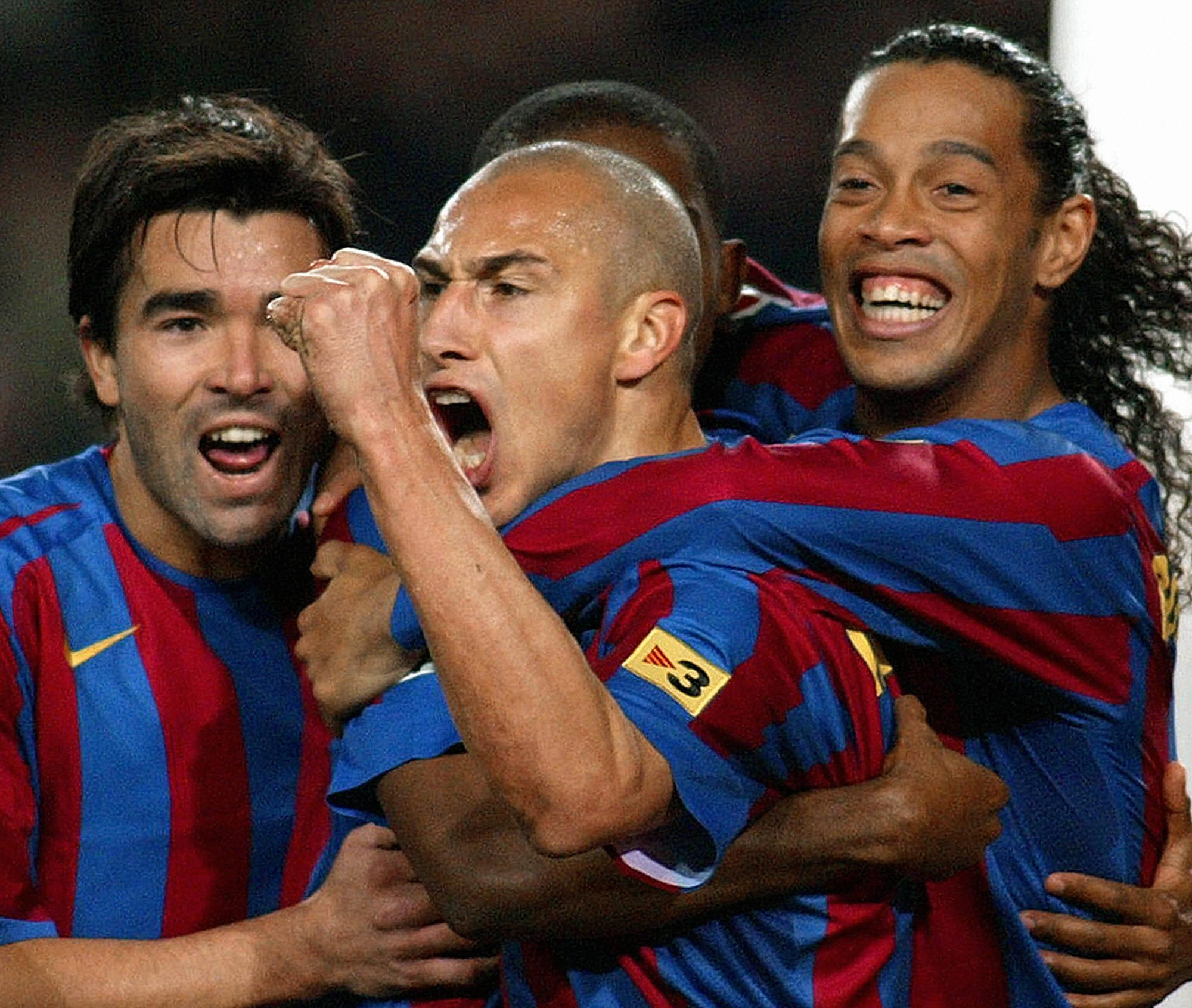 Henrik Larsson (C) celebrate after scoring a goal with his team mates Deco (L) and Ronaldinho (R) 