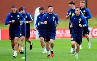 Scotland's John McGinn left, Andrew Robertson and Callum McGregor