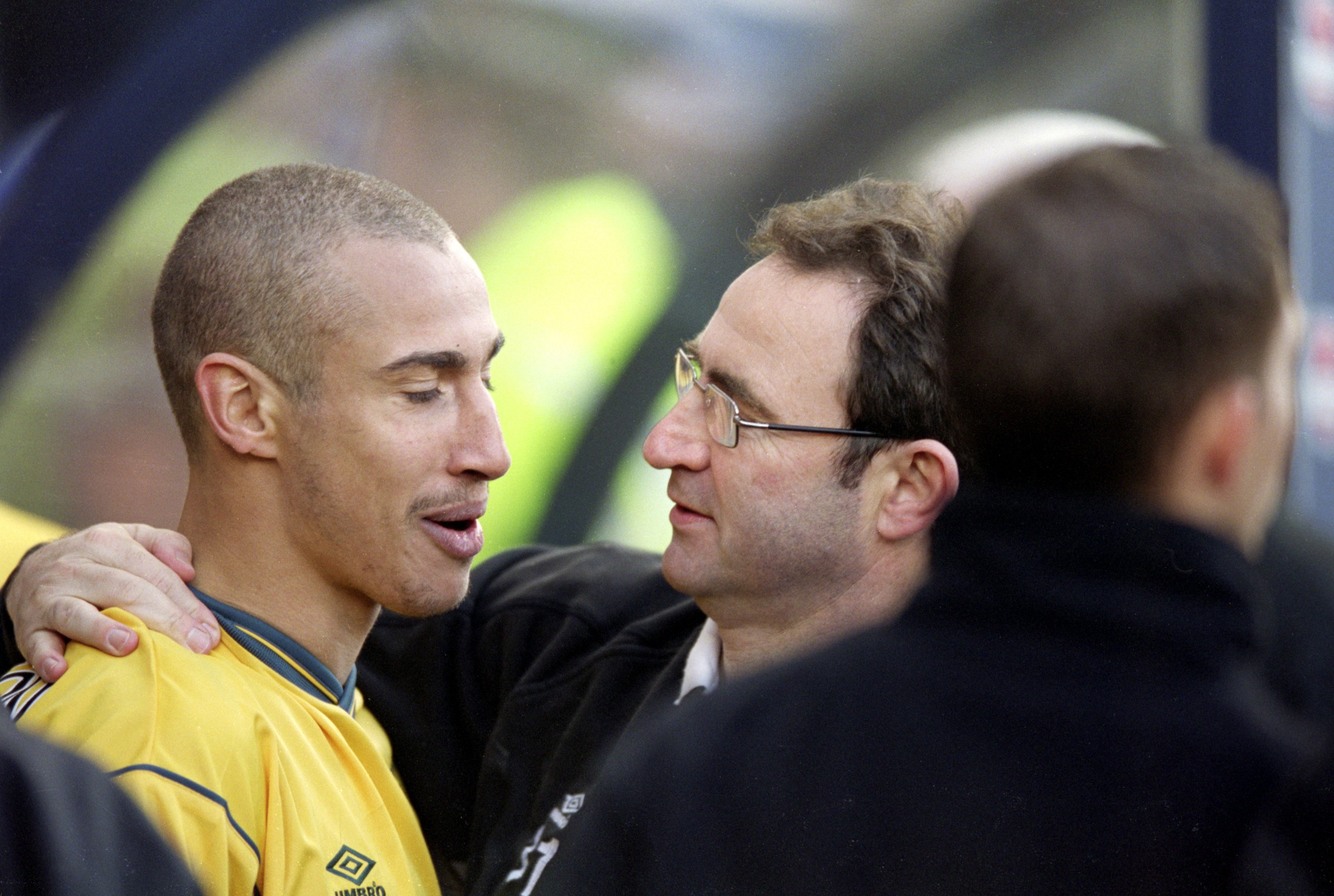 Henrik Larsson of Celtic is congratulated by his manager Martin O''Neill