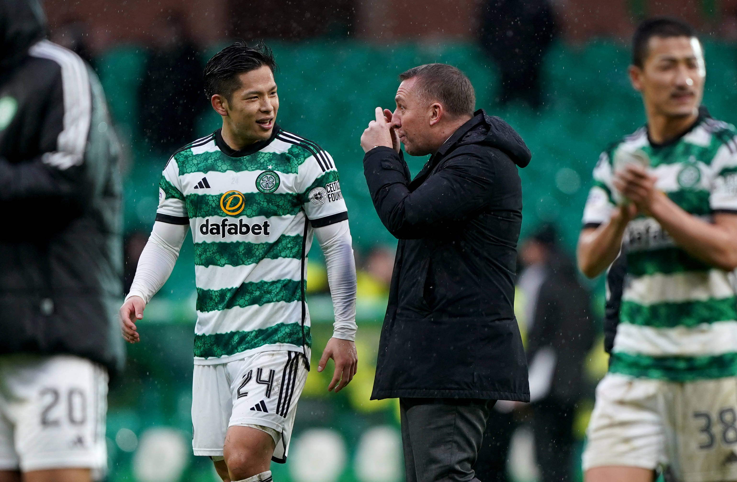 Brendan Rodgers speaks with Tomoki Iwata