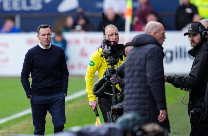 Clement passes on shaking Don Cowie's hand
