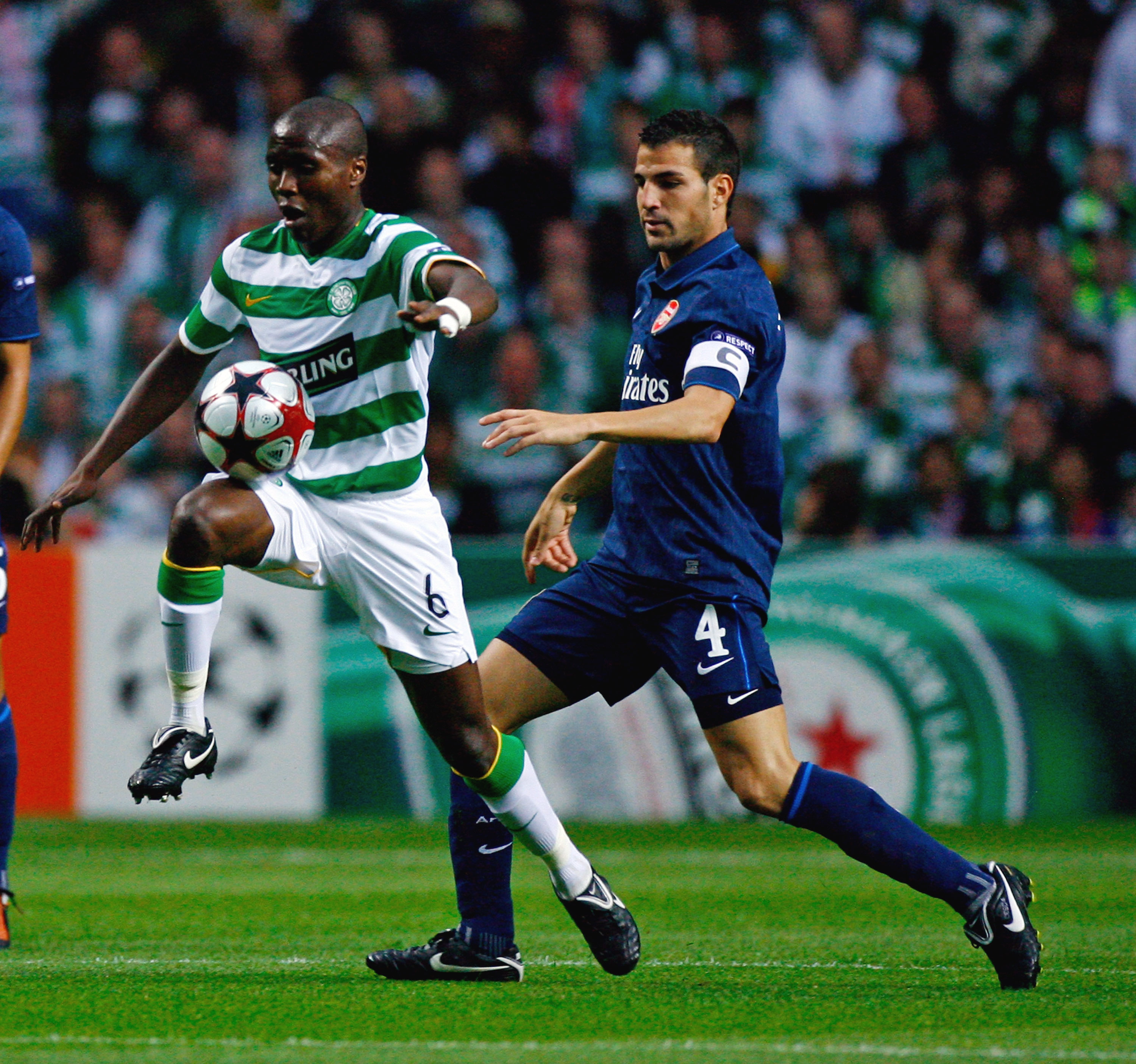 Landry N'Guemo of Celtic tackles Cesc Fabregas of Arsenal 