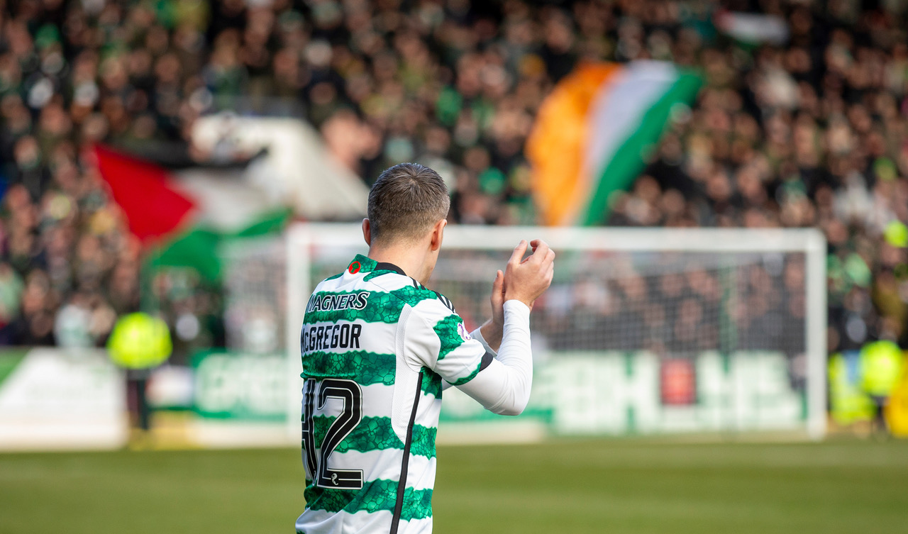 Callum McGregor applauds the Celtic support