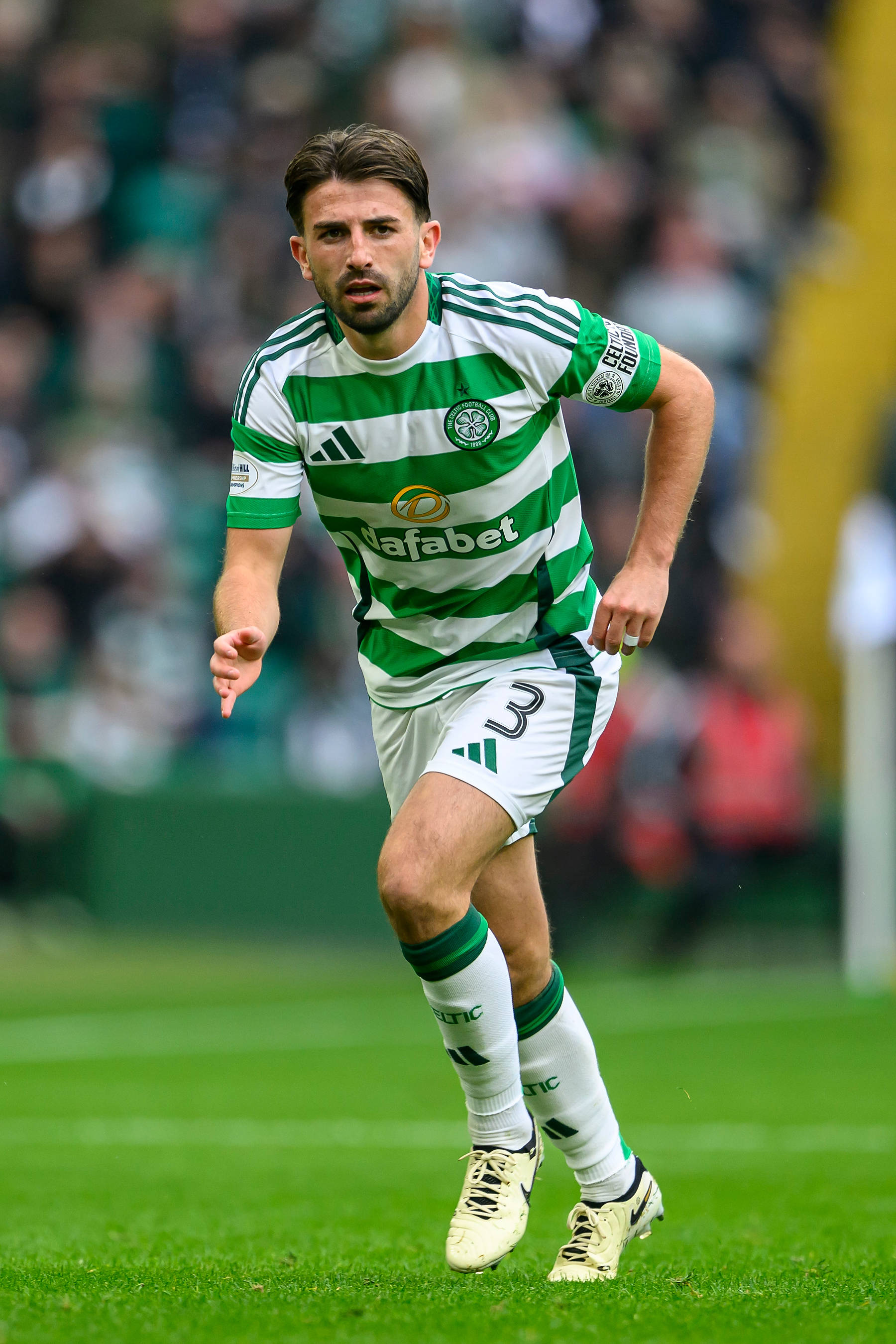 Greg Taylor in action against Hearts