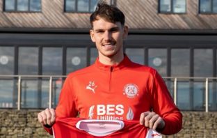 Liam Shaw all smiles as he signs for Fleetwood Town