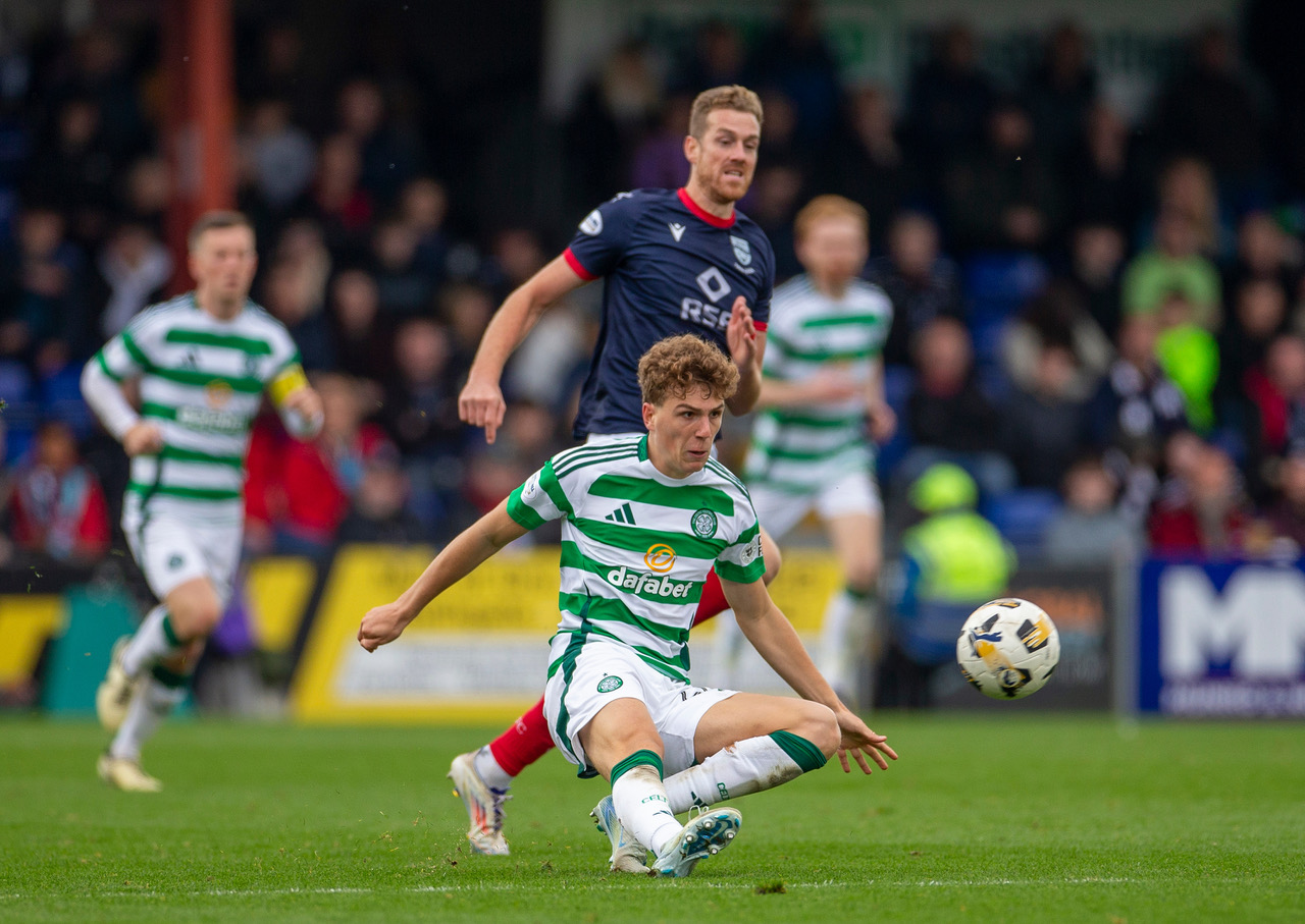 Arne Engels of Celtic plays the ball against Ross County. 