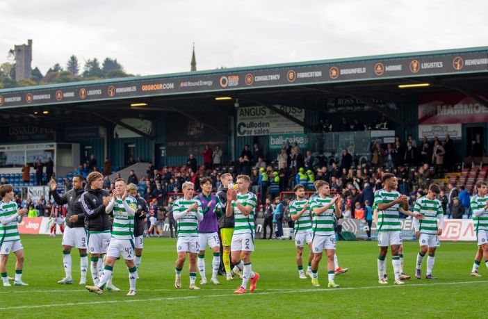 Celtic players acknowledge the away support
