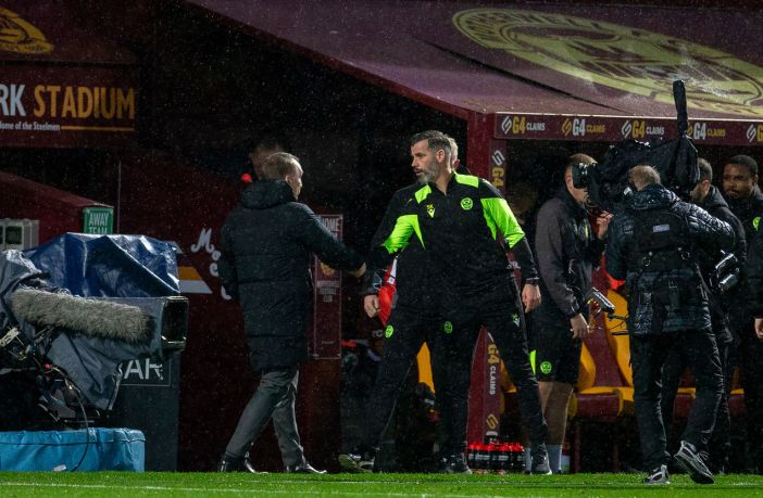 Manager's shake hands at full time