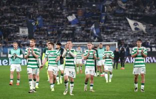 Celtic players applaud the fans