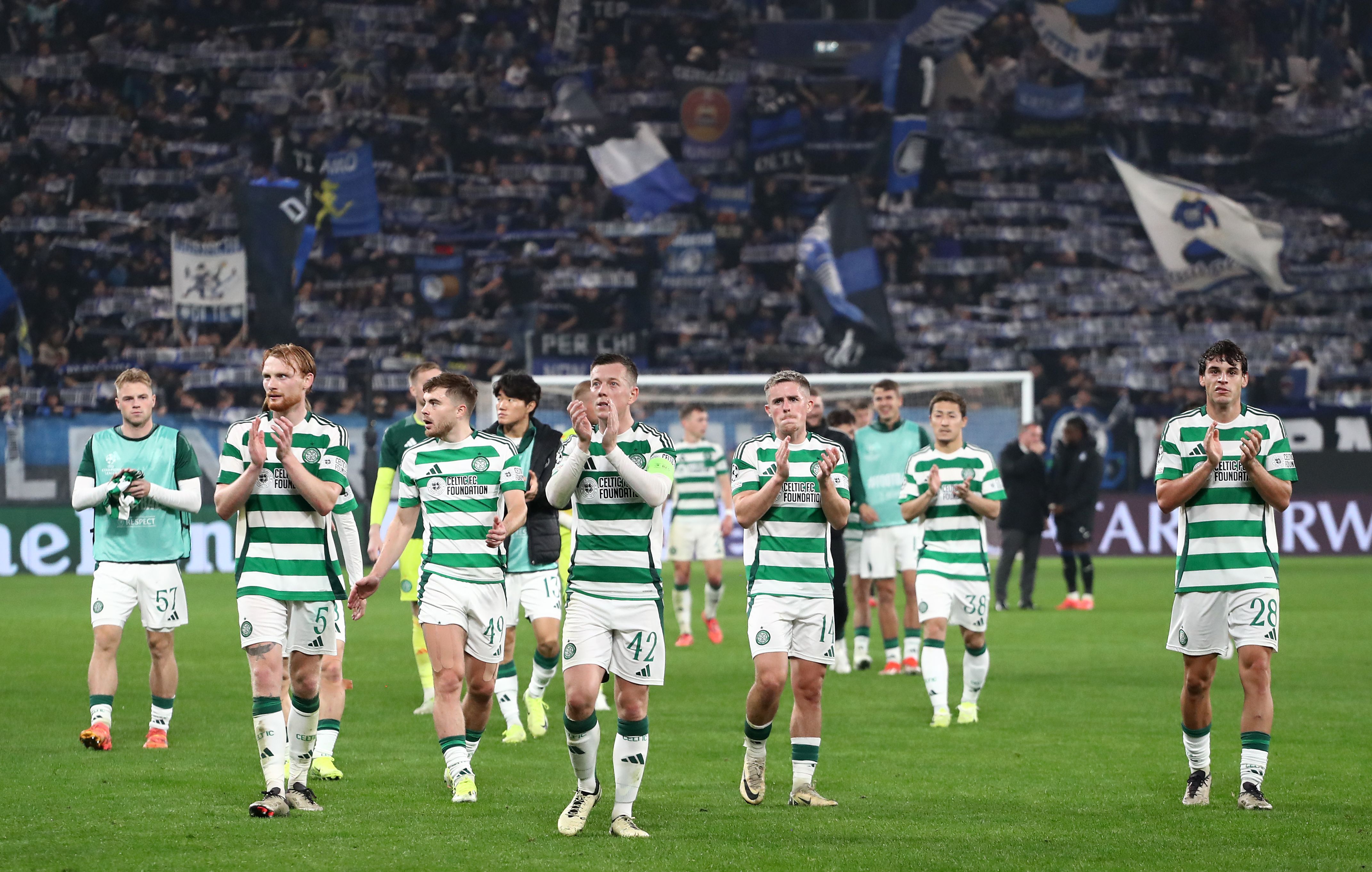 Celtic players applaud the fans 