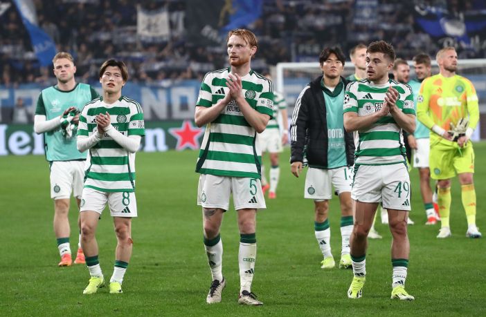 Celtic players applaud the support
