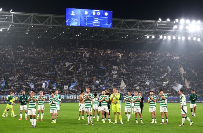 Celtic FC players applaud the fans