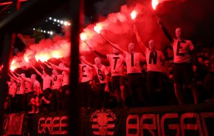 Celtic fans in Dortmund holding flares