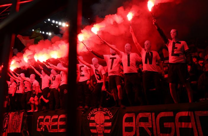 Celtic fans in Dortmund holding flares