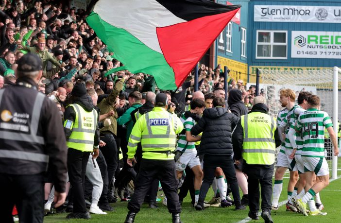 Nicolas Kuhn, already on a yellow, celebrates with the Celtic supporters after scoring the winner