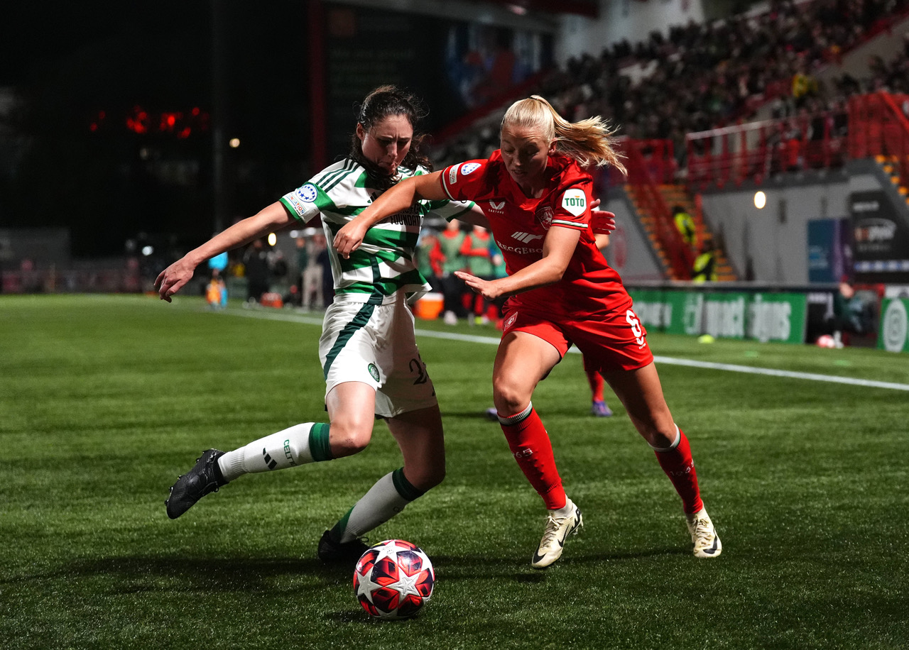 Celtic s Emma Lawton (left) and FC Twente s Ella Peddemors battle for the ball