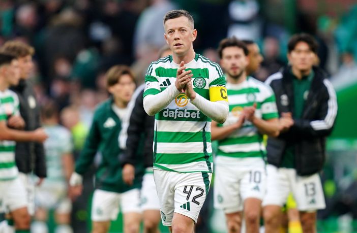 Callum McGregor applauds the fans