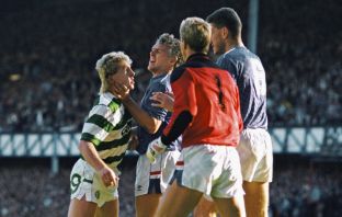 Frank McAvennie is held by the throat