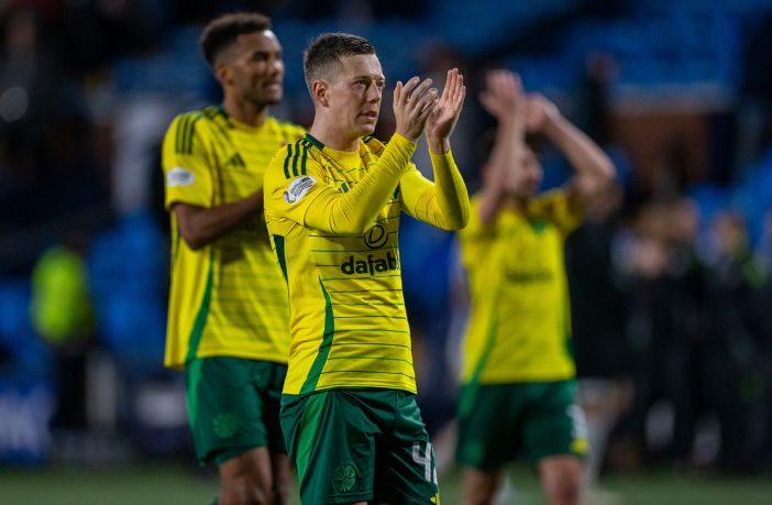 Auston Trusty and Callum McGregor applaud the support