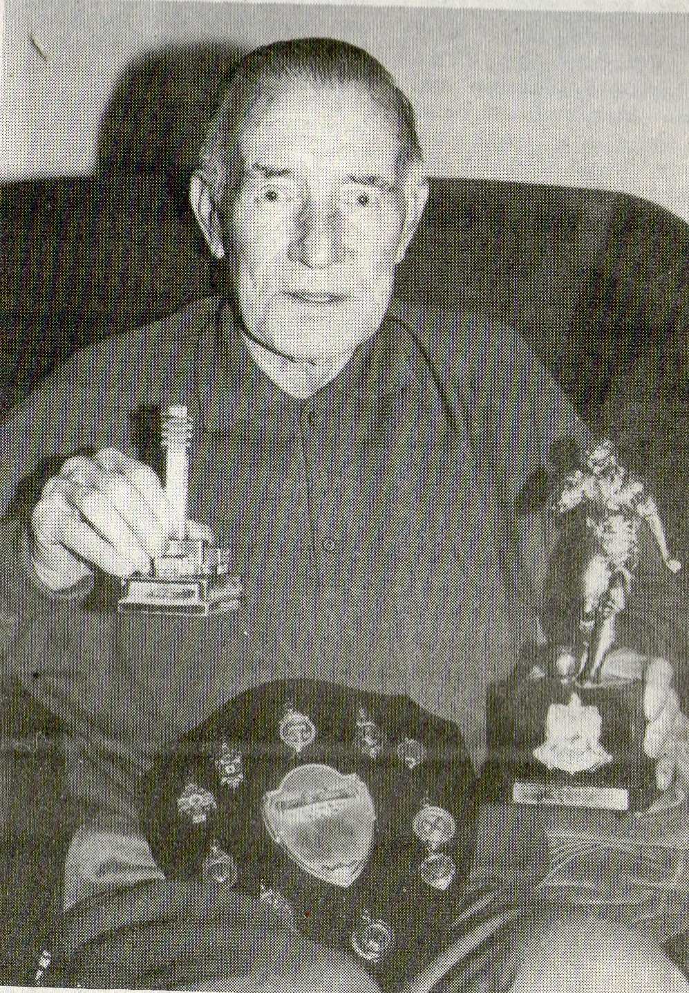 Jock Morrison at home with his medals