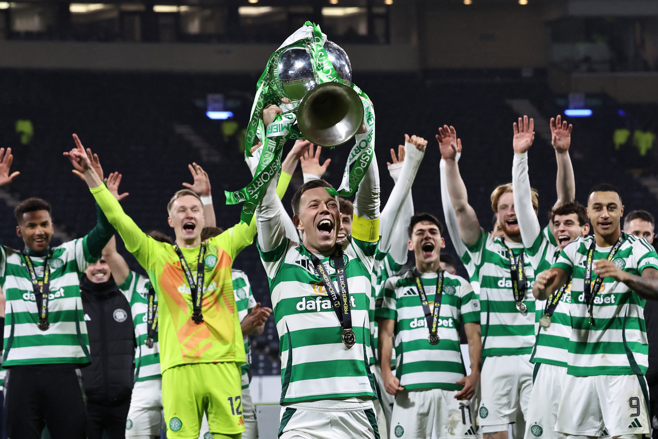 Callum McGregor lifts the cup
