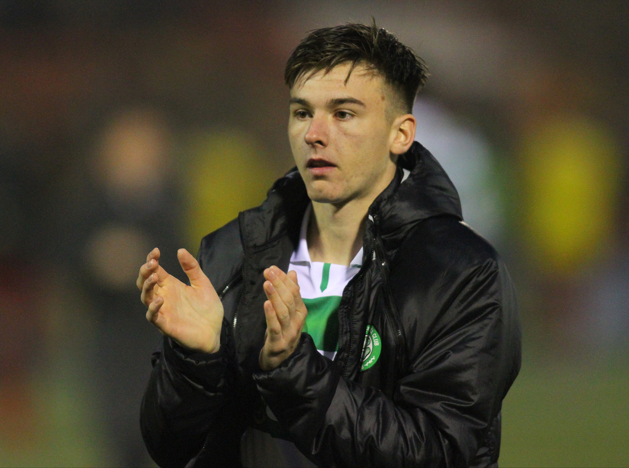 Kieran Tierney applauds the support