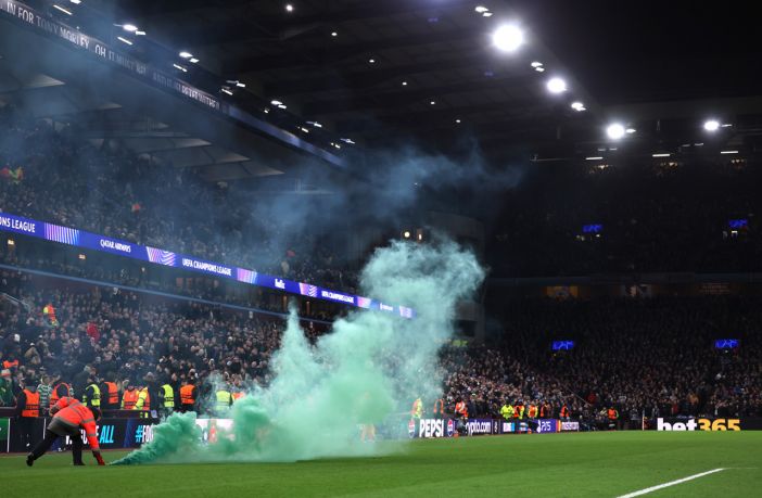Green flare on the pitch at Villa Park