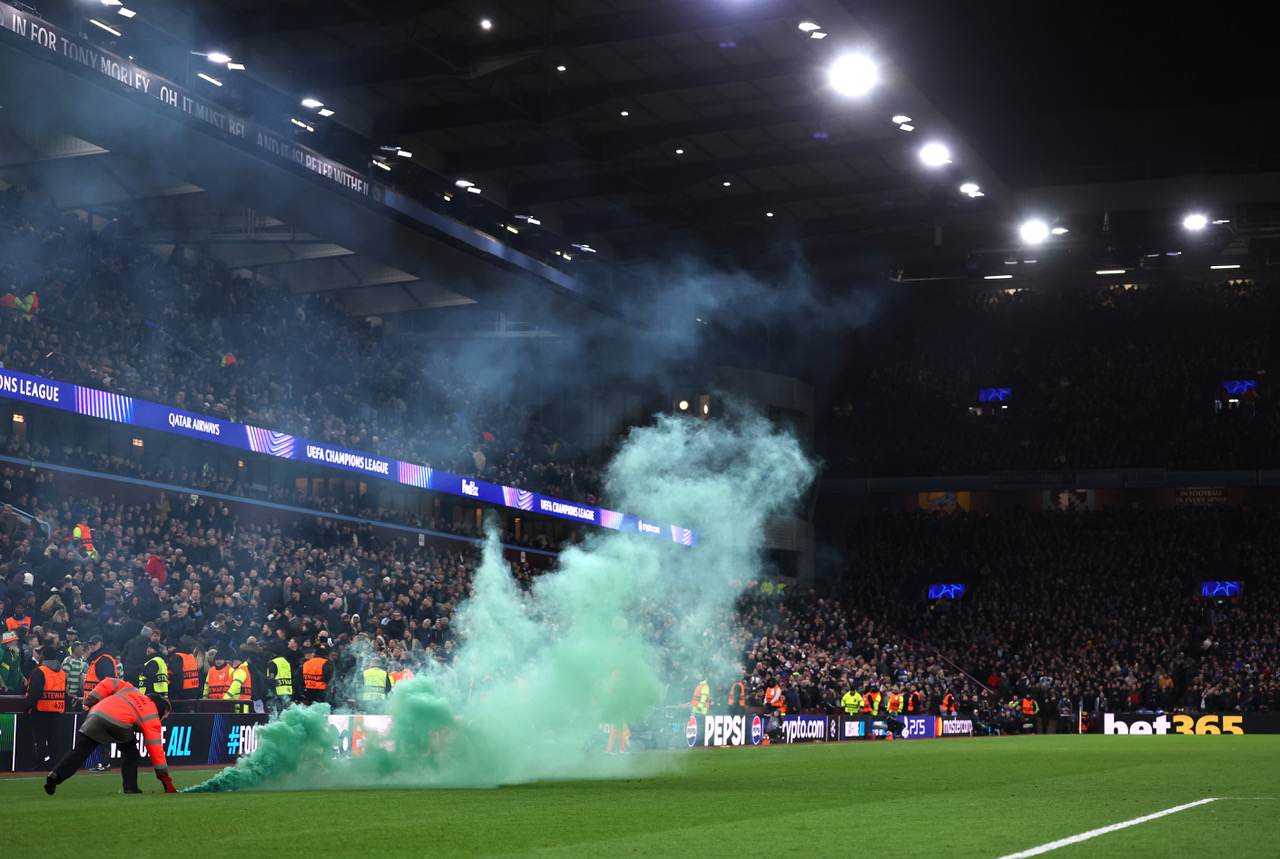 Green flare on the pitch at Villa Park