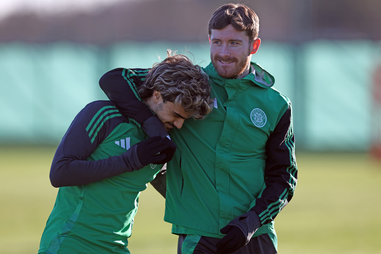 Jota gets a welcome back hug from Anthony Ralston.  