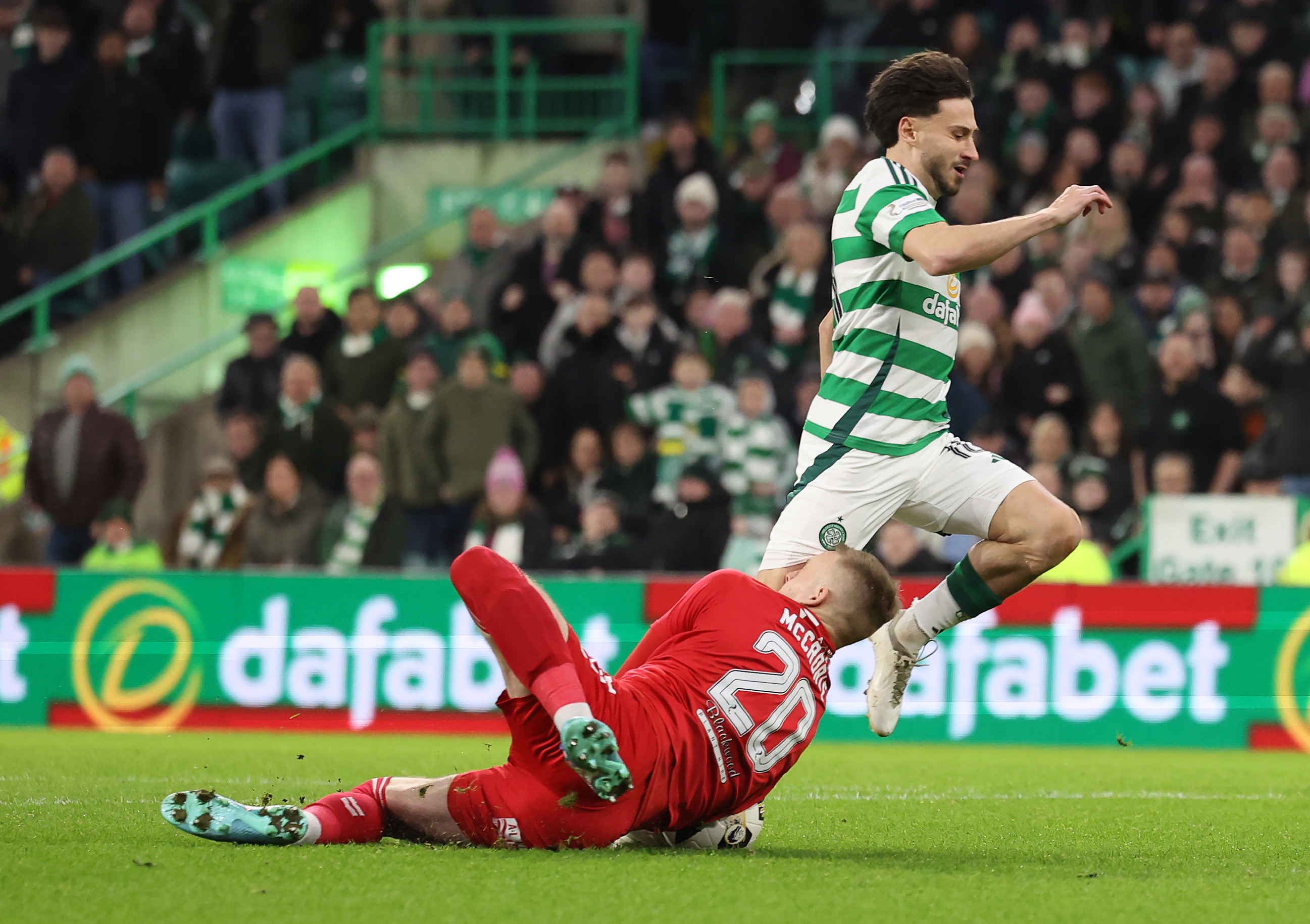 Nicolas Kühn of Celtic collides with Robby McCrorie