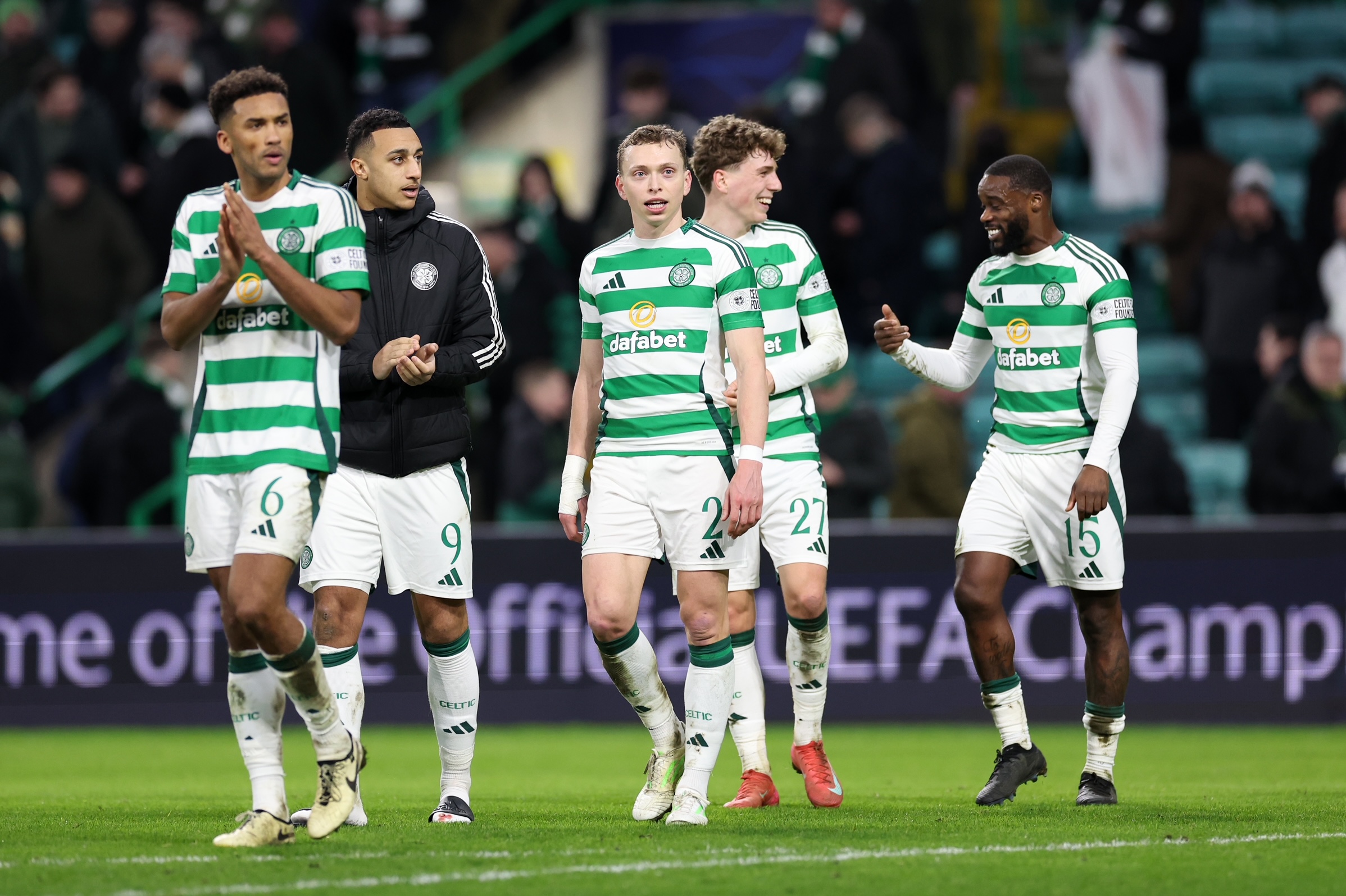 Celtic players applaud the support
