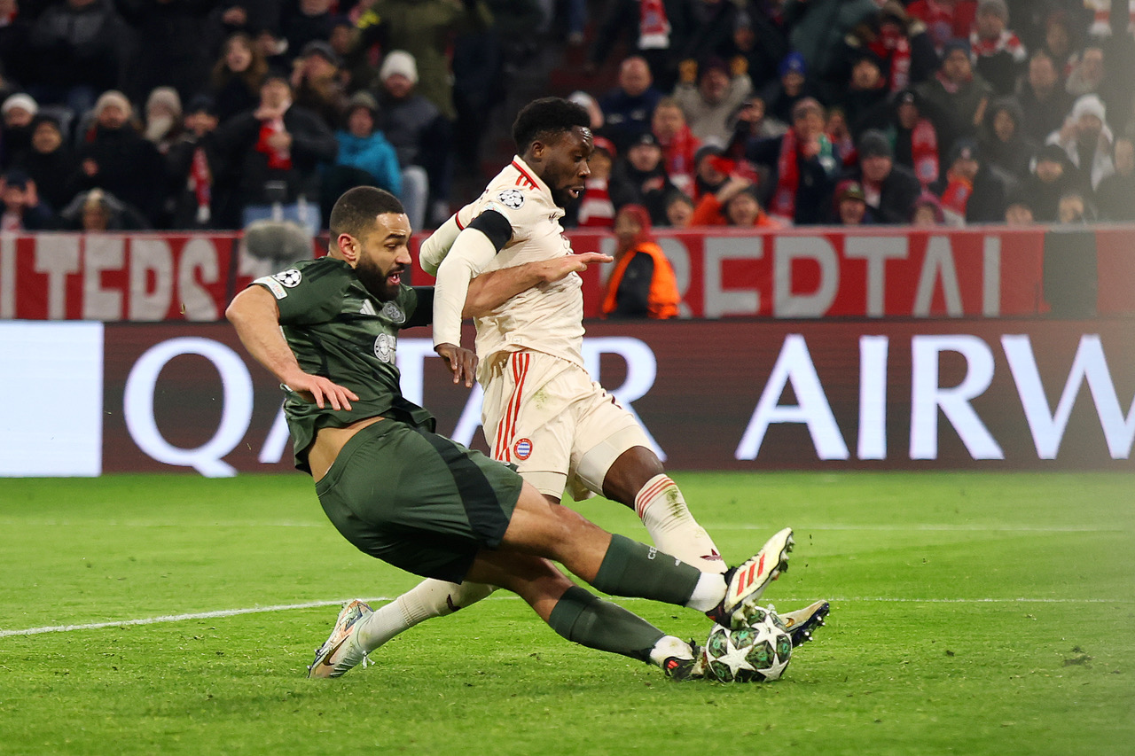 Davies blocks the ball into the net