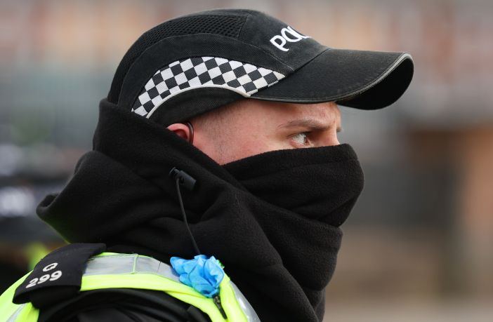 Police officer wearing a face covering