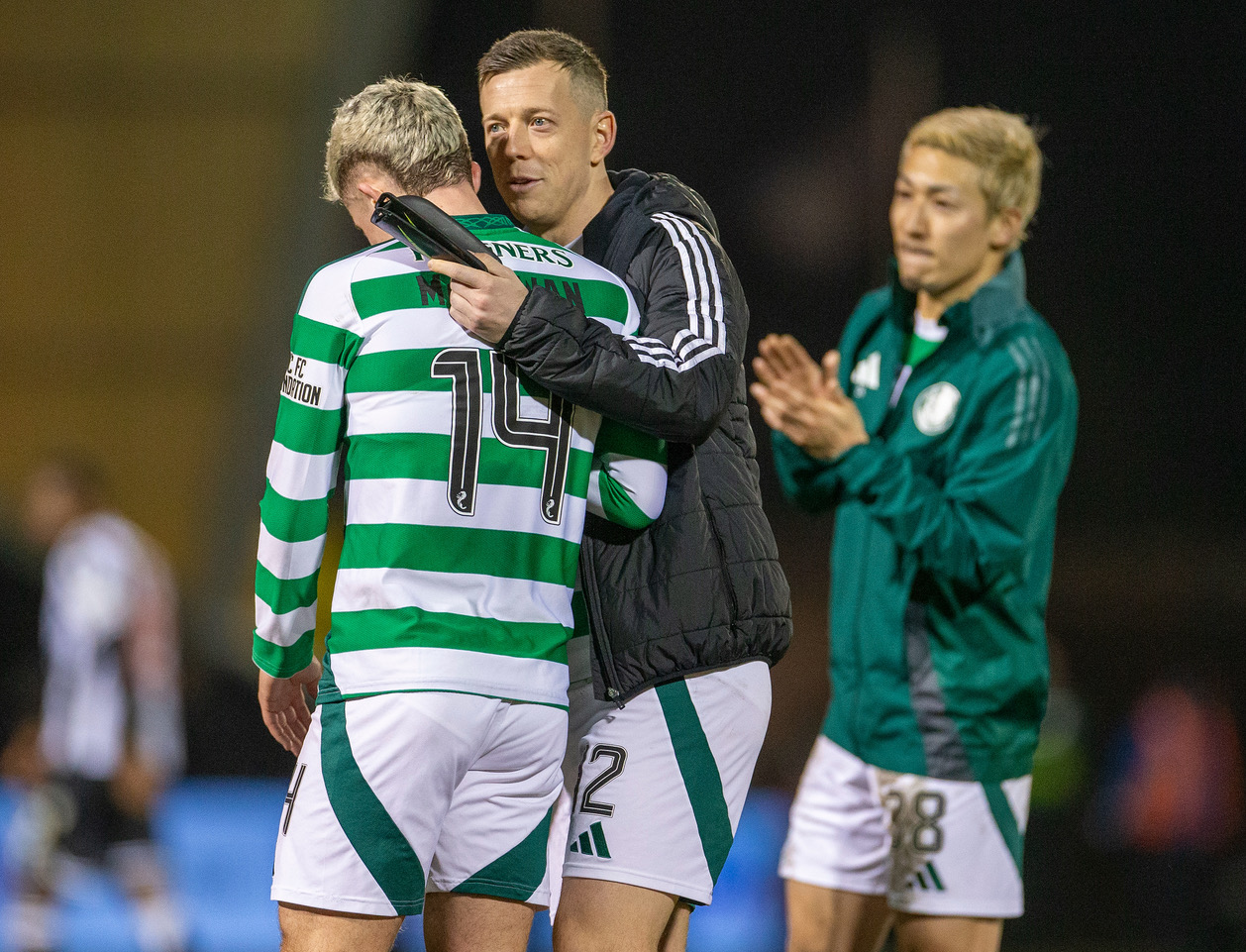Callum McGregor has a word with Luke McCowan.