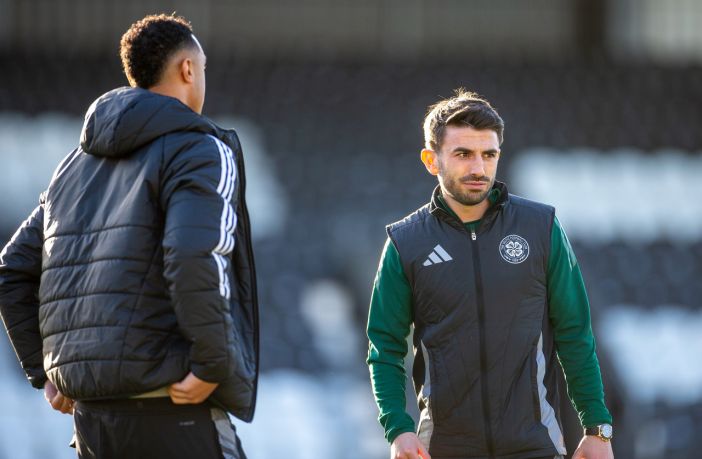 Greg Taylor inspects the pitch.