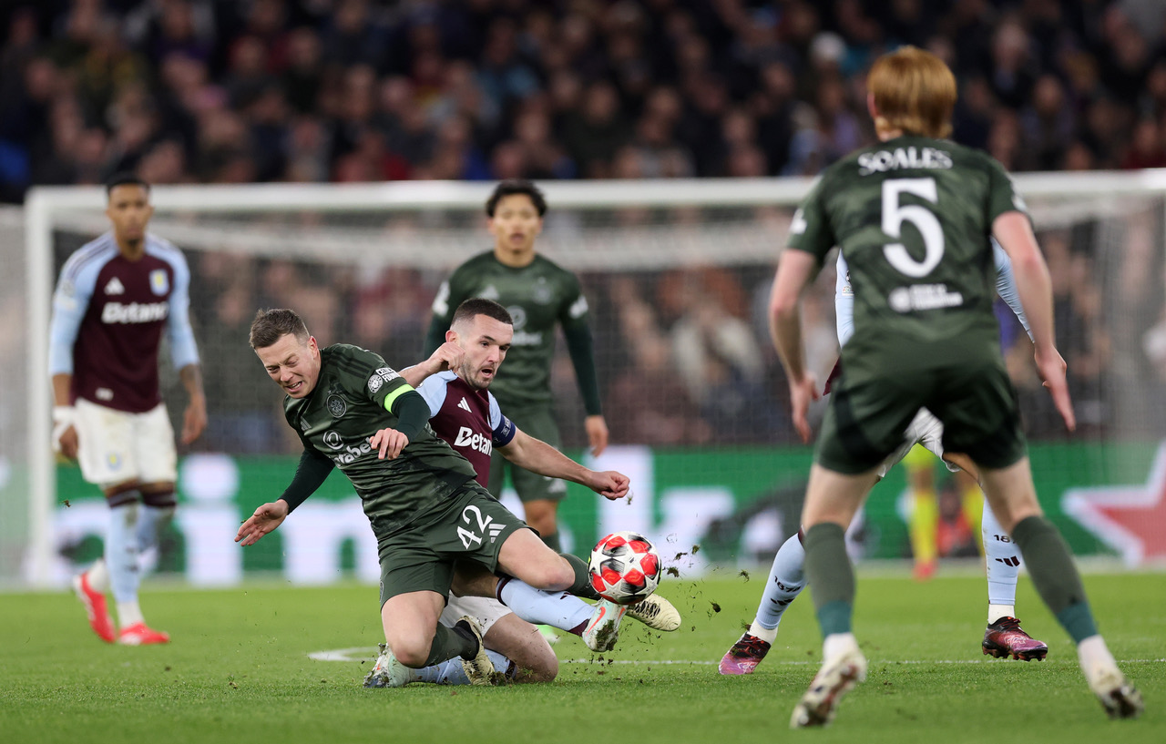 John McGinn challenges Callum McGregor 