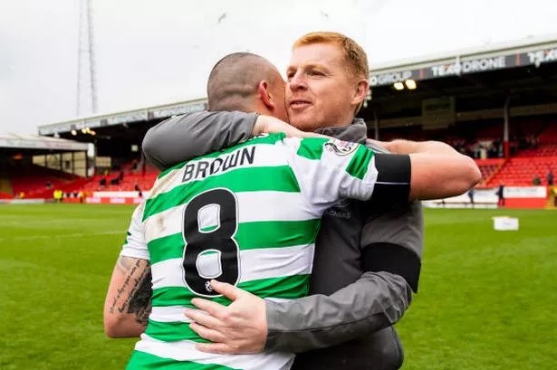 Scott Brown embraces Neil Lennon. Photo Big Lens 