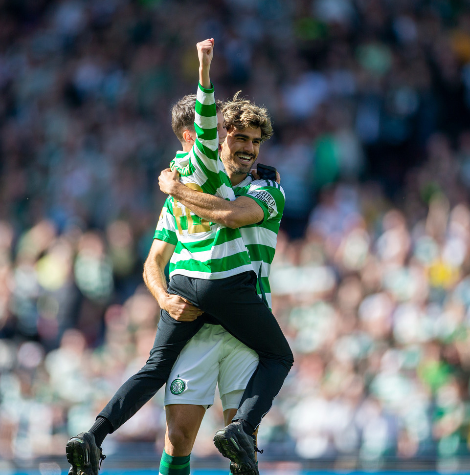 Jota celebrates with a young supporter