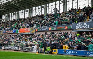Celtic supporters doing the Huddle