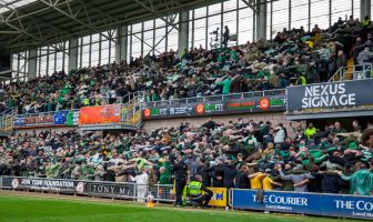 Celtic supporters doing the Huddle