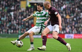 Nicolas Kuhn of Celtic vies with Harry Milne of Hearts