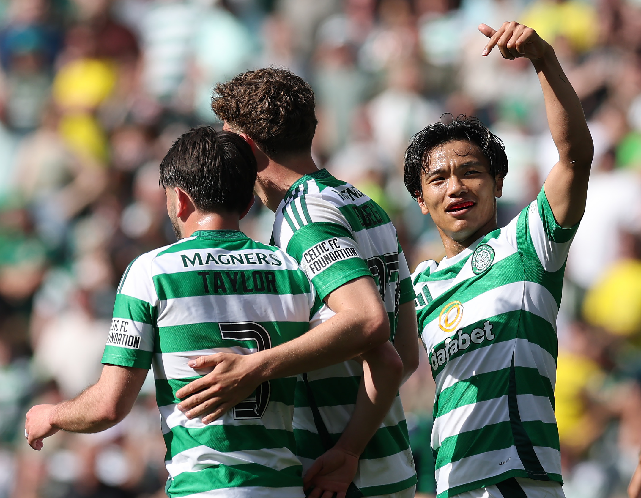 Reo Hatate celebrates