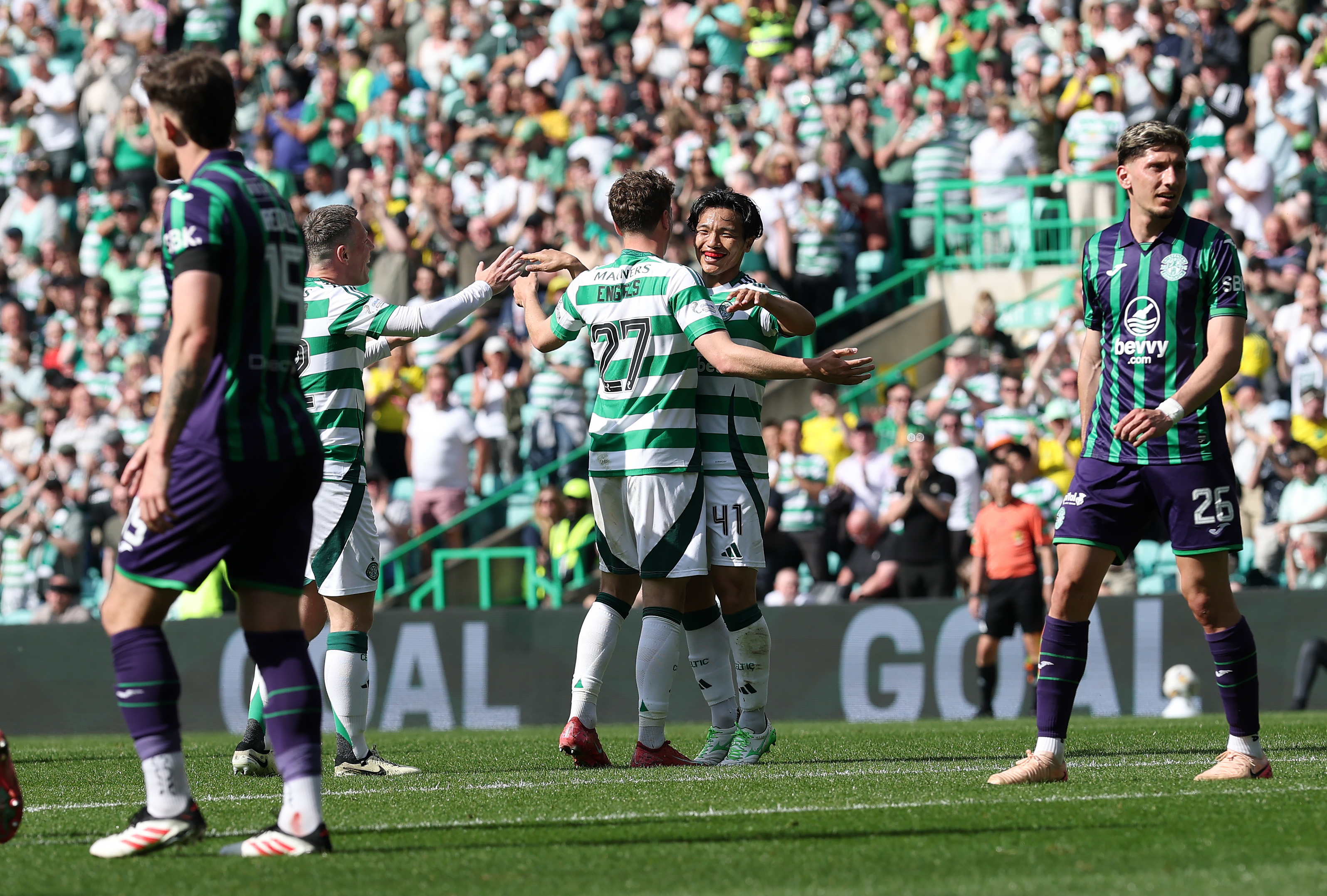 Reo Hatate celebrates