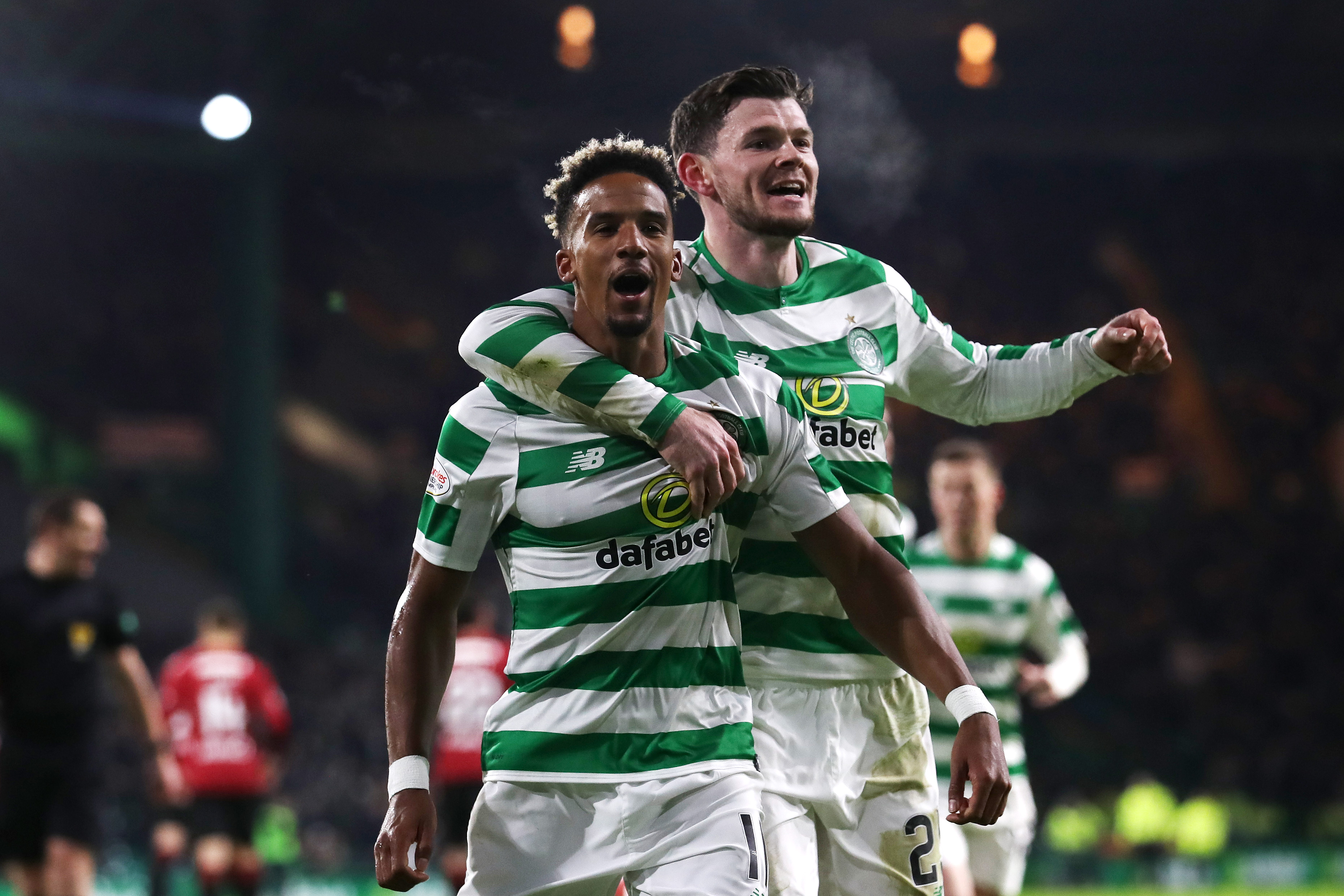 Scott Sinclair of Celtic celebrates with team-mate Oliver Burke